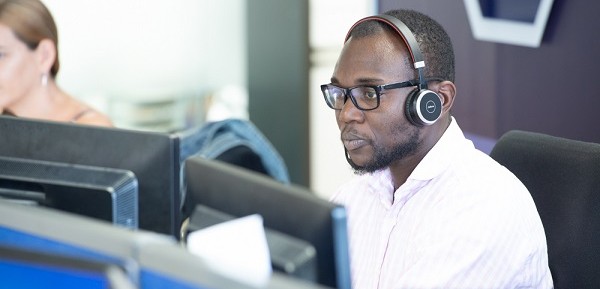 AutoProtect claims engineer, male, headset, office environment