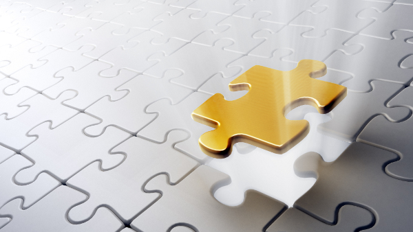 Affinity Partners | AutoProtect | White jigsaw with missing piece, gold piece about to drop into place